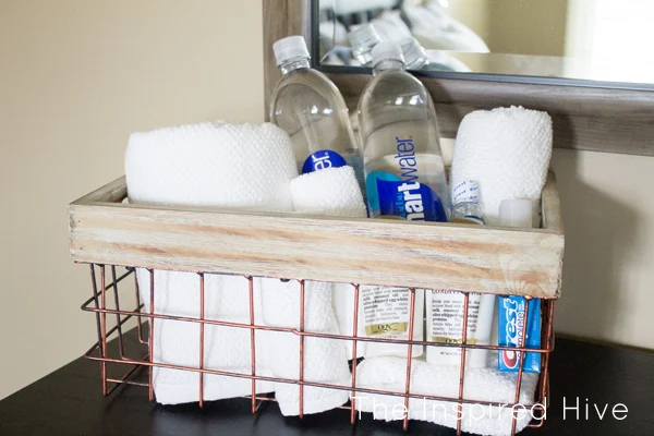 Guest room welcome basket essentials. Decorating ideas for an industrial farmhouse guest bedroom. A room makeover reveal with rustic industrial decor and a touch of farmhouse style.