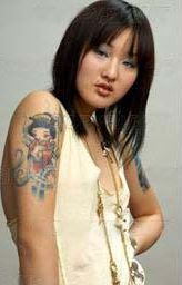 Asian woman with tattoos