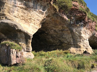 A view of the caves in the rock face.  Photo by Kevin Nosferatu for the Skulferatu Project.