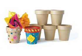 Decorate Paper Mache flower pots and fill with candy or travel sized items for an easy Girl Scout Founder's Day Craft