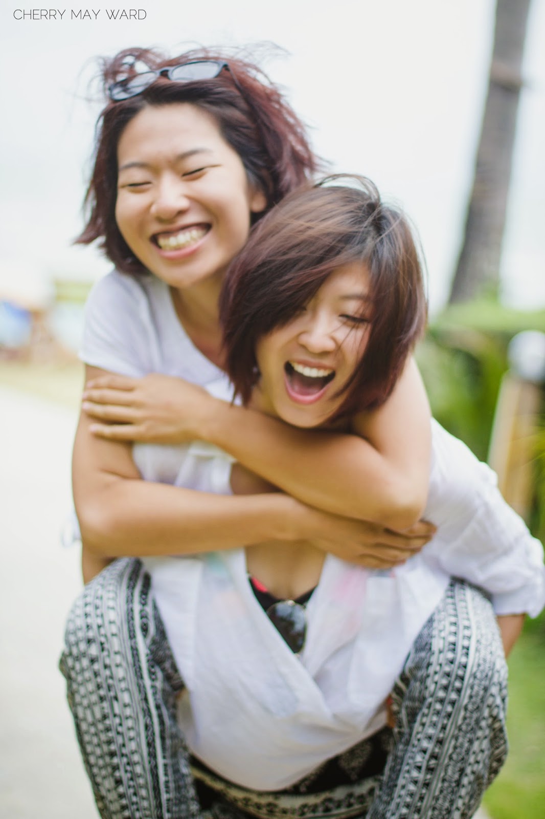 chinese couple piggyback, piggy-back photos, cute piggyback photos, fun photos of couple piggyback, happy young Chinese couple, Koh Samui Professional photographer, Cherry May Ward Photography