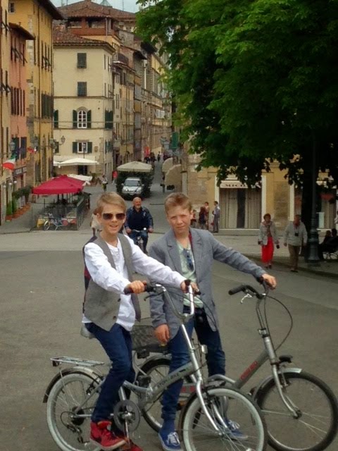 Boys with bikes in Lucca