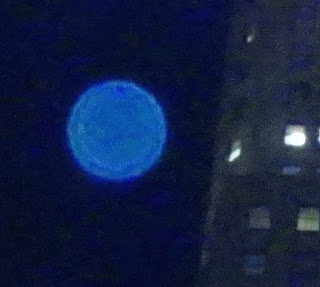 blue orb in sky