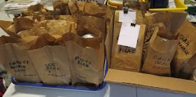 paper bags filled with meals and labeled