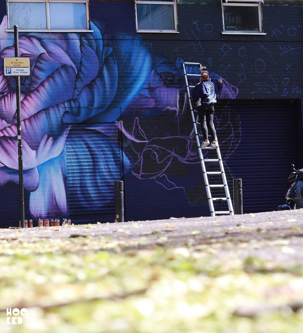 Mural work in progress by street artist Sophie Mess - Hit the North Belfast Street Art Festival
