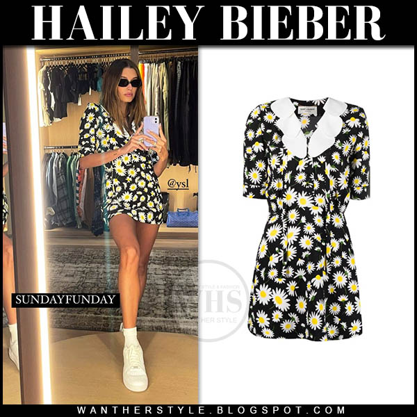 Hailey Bieber in black daisy print mini dress and sneakers