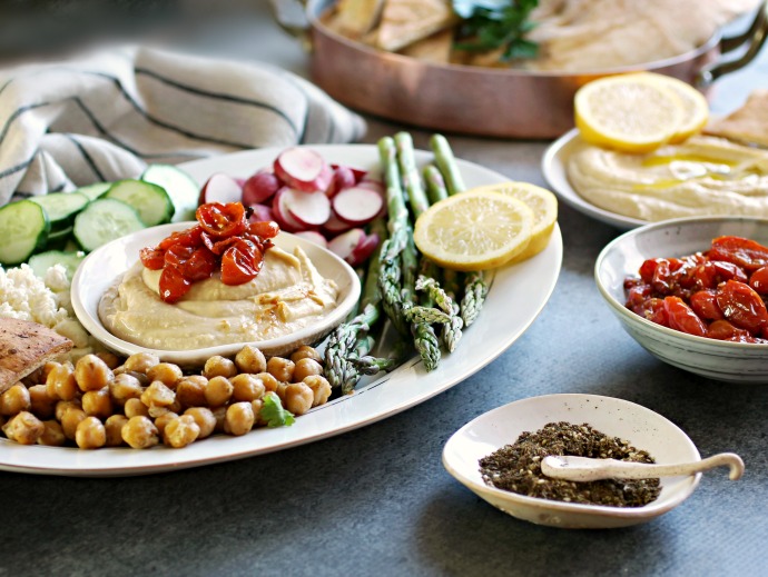 Recipe for roasted tomatoes and a tutorial on putting together a hummus party platter and fixings bar.