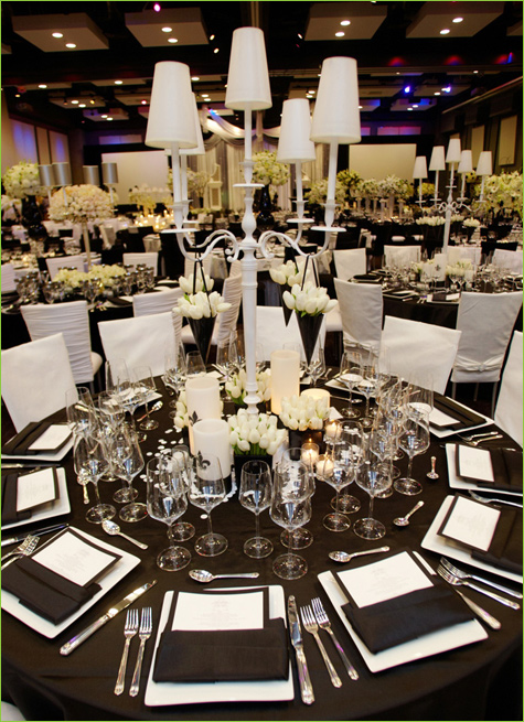 Black and white linens with sparkling china glasses and candles really pop 