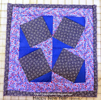 http://joysjotsshots.blogspot.com/2015/01/quilt-shot-block-27-happy-new-year.html