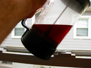 Hibiscus tea, the color of the finished beer wasn't that dark (but it is still eye-catching.)