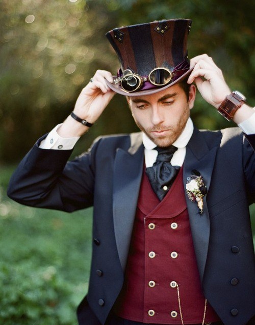 A Steampunk groom wearing a top hat, vest, jacket, and tie. Fashion inspiration for a Steampunk wedding.