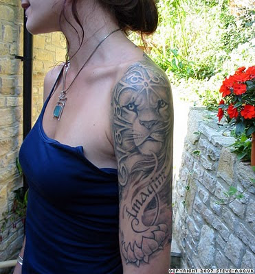 Lion Tattoo Design on Sexy Girl Arm Sleeves. Random Tattoo Quote: "The woman 