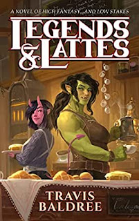 Two people (one a green orc, one a bright pink succubus) stand back to back behind a bar serving delicious drinks and baked goods.
