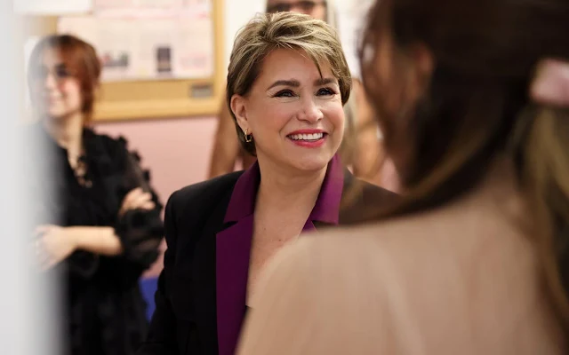 Grand Duchess Maria Teresa wore a black shirt jacket and a purple silk blouse. Women in Distress organization