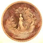 photo of carved cameo of woman in the woods