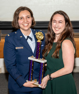 Air Force Lt. Cecelia Mangione (left) was awarded both first place and the People's Choice award at the 3 Minute Thesis Competition at USU. (Photo credit: Tom Balfour, USU)