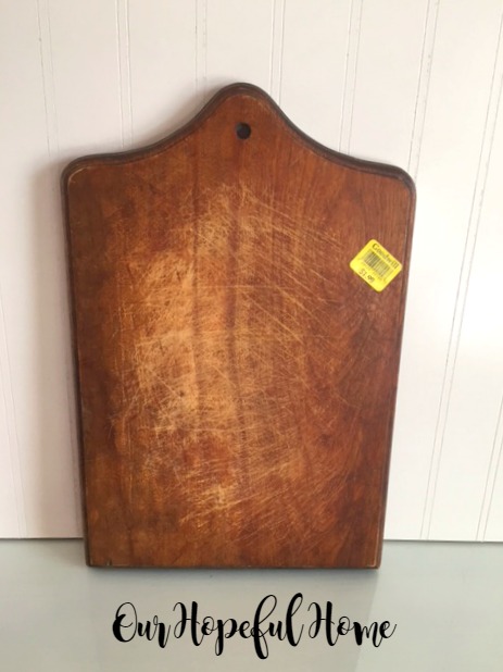 thrift store wooden cutting board with scratches