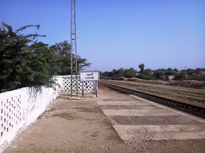 Chhab railway station platform exit toward North. Railway station name board is placed and an electric pols is also visible