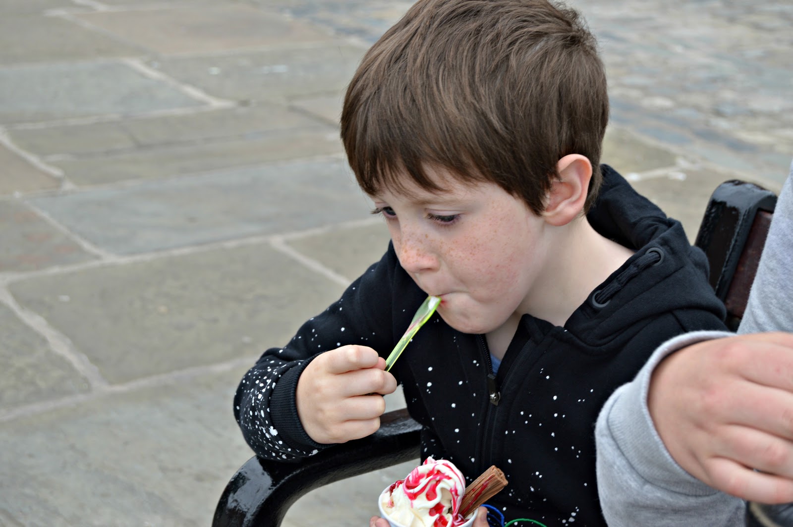 young boy eating an ice cream