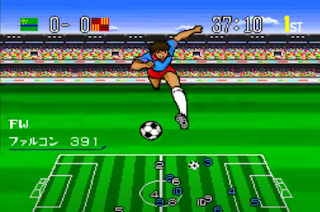 player with light blue t-shiort on with red shorts on green football piece with the man looking like animation style and shows Japanese language and ball below his feet and like map of football pitch below