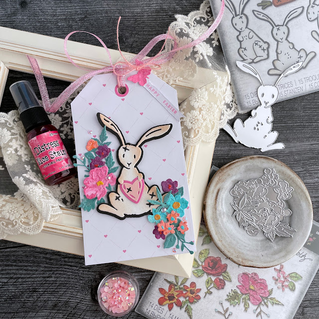 Velveteen Rabbit Easter Bunny tag created with: Tim Holtz bunny stitch, brushstroke flowers mini die, distress spray stain, oxide spray, mica stain, distress ink; Doodlebug velvet cardstock; Scrapbook.com nested tags, butterflies die, sherbet pattern paper, smooth cardstock; Pinkfresh jewels