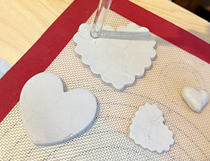 straw to make holes in clay hearts