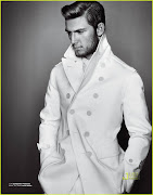 Alex Pettyfer with facial hair and a coat.
