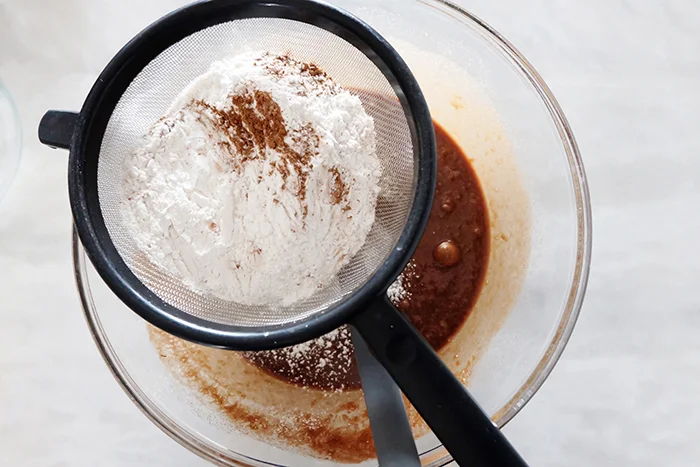 sifting dry ingredients into wet