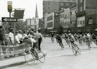 Bicyclists rounding the corner of a designated street race course