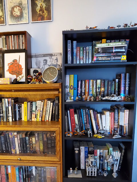 an image of bookshelves with art and legos