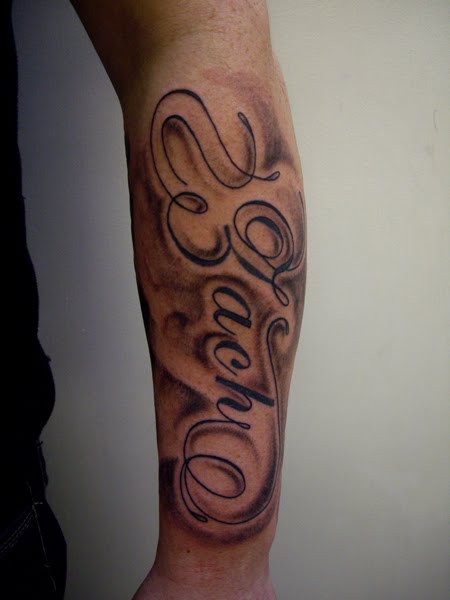 Large names and shading on the forearm tattoo names on arm