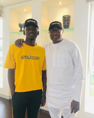 Mr Eazi strikes a pose with his billionaire father -in-Law Femi Otedola