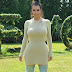 Kim Kardashian wears tight beige dress, Displays her massive figure. see pictures