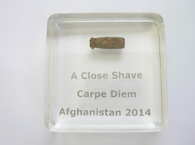 Bullet in a Paperweight