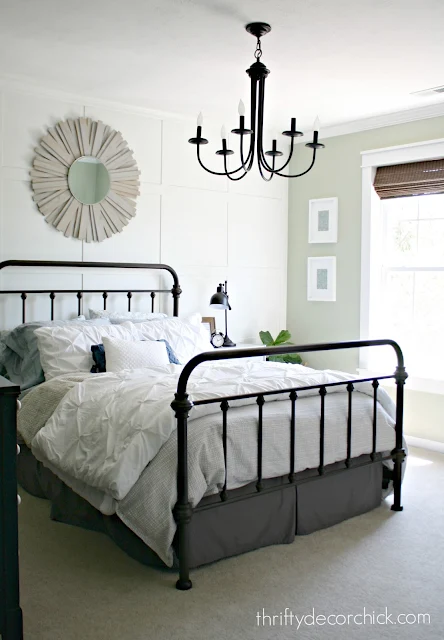 Light green bedroom with white accent