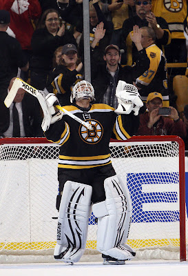Tim Thomas celebrates the win over the Leafs