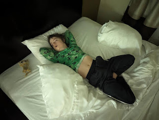 Spencer, asleep in a hotel, November 2023