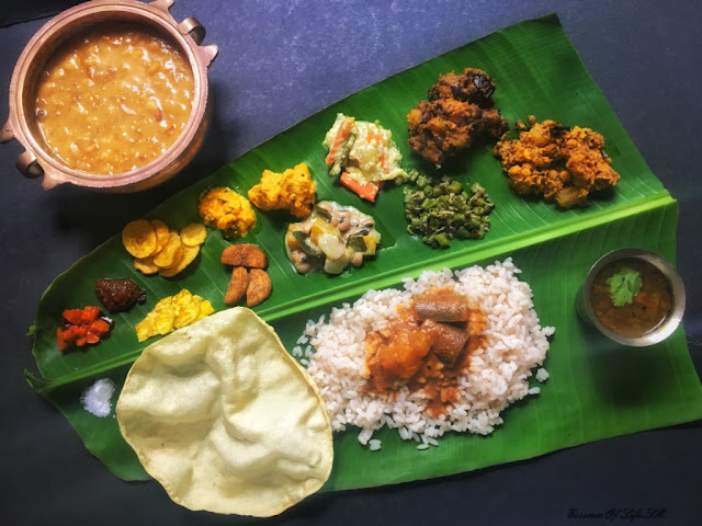 "A traditional Kerala Sadhya spread with perfectly cooked Kerala Matta Rice served alongside an array of vibrant and flavourful vegetarian dishes on a banana leaf."