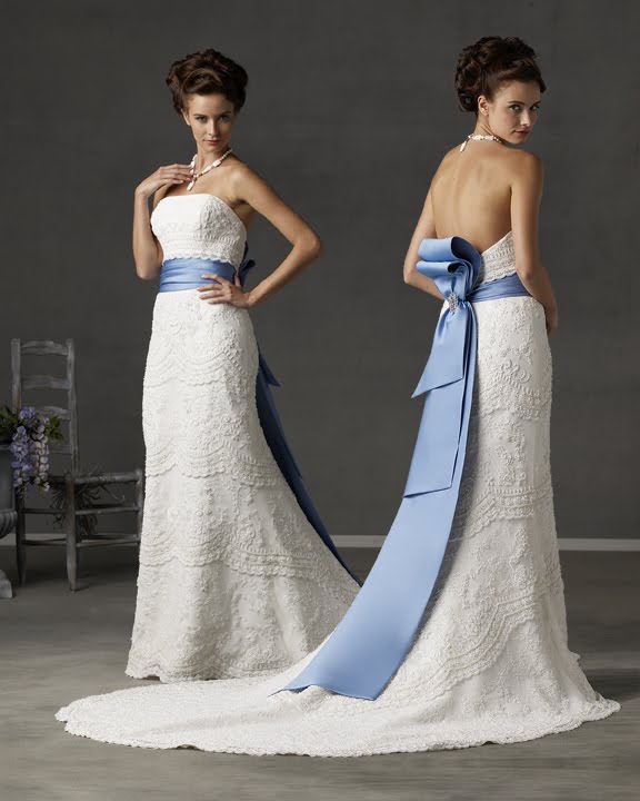 White wedding dress decorated with blue ribbon