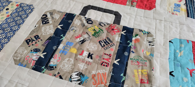 Suitcases quilt made with Pan Am fabric by Riley Blake
