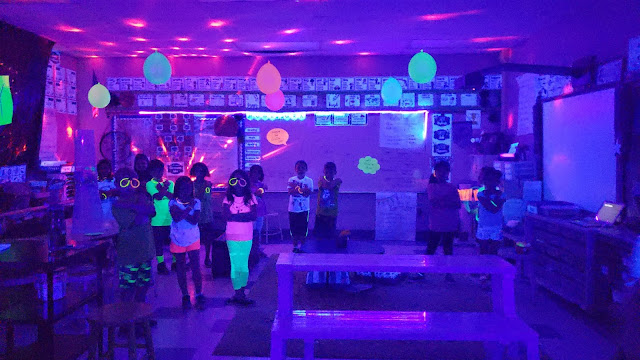 One of the best and easiest classroom transformation ideas for elementary, middle and even high school is Glow Day. It is easy to include lessons for math, reading, science, social studies and writing into a fun filled and exciting day under the blacklight. All you need to do is print on paper that glows. Here are some ideas for making games, activities, centers, stations, rotations and assessments glow for Kindergarten, 1st, 2nd, 3rd, 4th, 5th, 6th, 7th, 8th, 9th, 10th, 11th & 12th graders.  