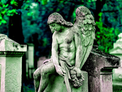 angel sitting on grave