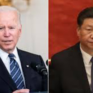China's Xi and Biden converse as tension over Taiwan rises.