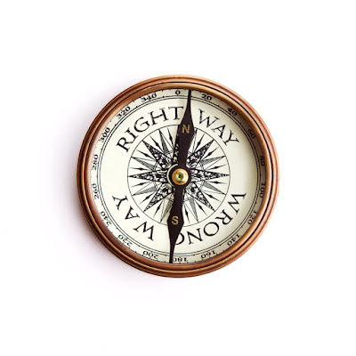 Picture of a compass with an arrow pointing to the right way or the wrong way