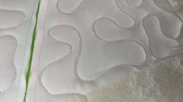 Meander free motion quilting on a longarm