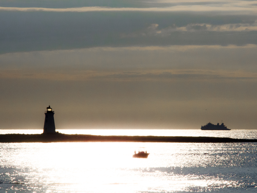 The Fayerweather Lighthouse in Bridgeport CT.  With the Port Jefferson - Bridgeport Ferry beyond.