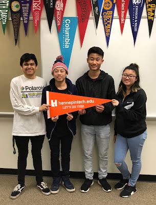 Park Center Senior High School students pose with a Hennepin Technical College pennant.