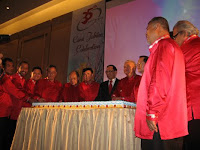 Cake cutting ceremony after the launch of the new logo