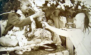 Srila Prabhupada Hands Japa Beads to New Initiate