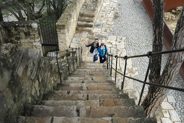 Us climbing Saint George's Castle or, Castle of São Jorge